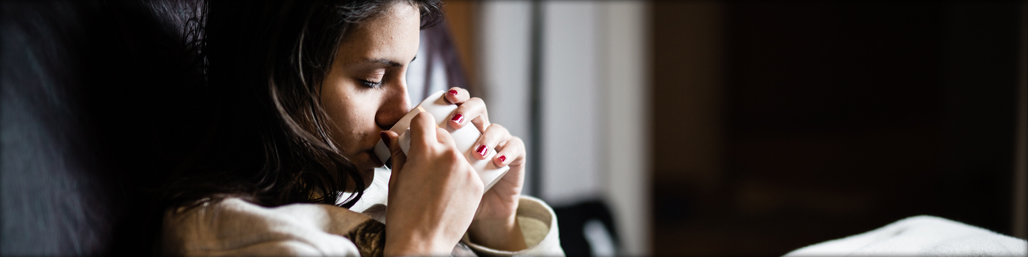 Woman Drinking From a Mug